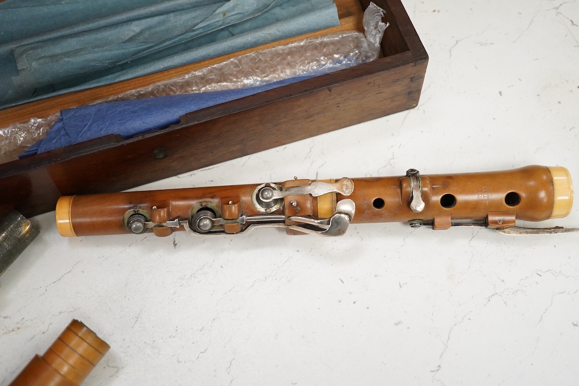 A 19th century boxwood and ivory flute by Potter, Johnson’s Court, Fleet Street, London, in a mahogany case, with early eight key system, ivory submission ref: RERLAL9Y
